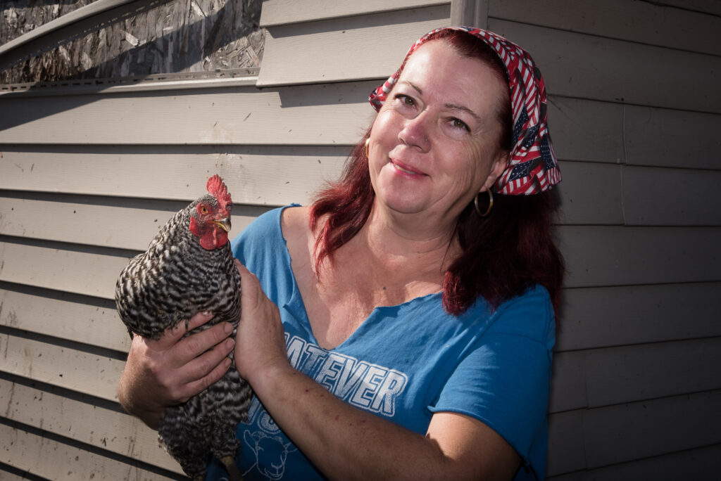 Wendy holding a chicken